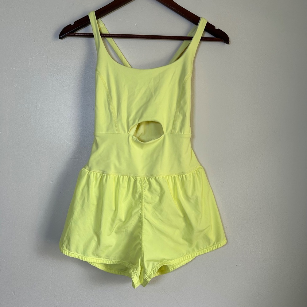 EUC Free People Movement Hot‎ Shot Romper Size XS Neon Yellow Cutout Pocket